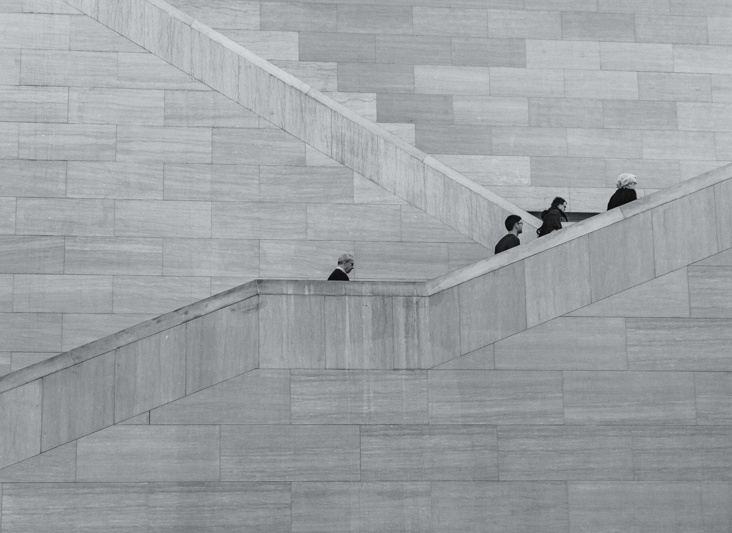 Men walking their own paths, side by side